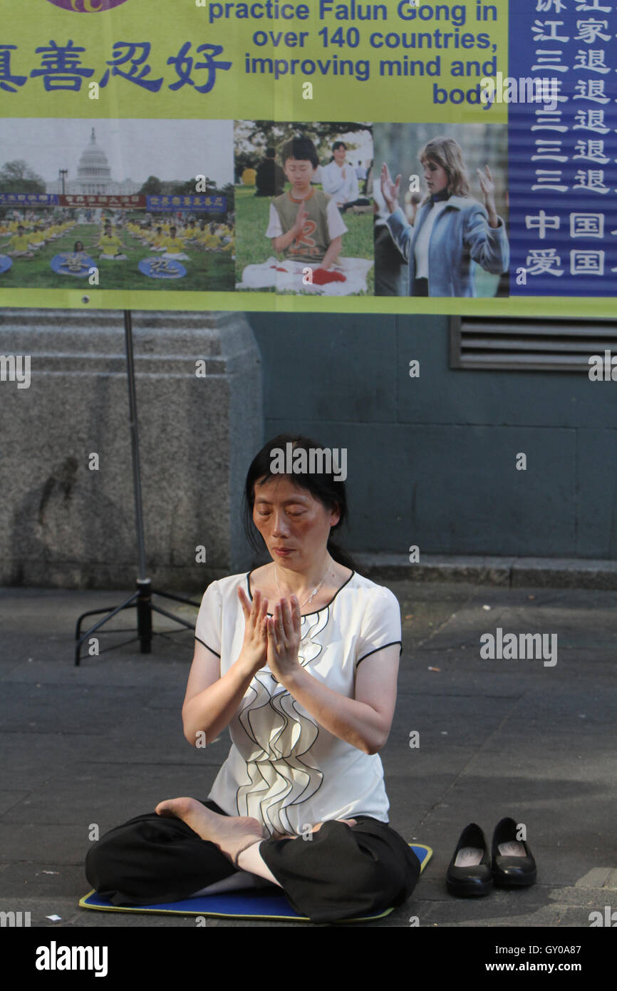 Female Falun Gong practitioner, China town Gerrard st London,   credit image©Jack Ludlam Stock Photo