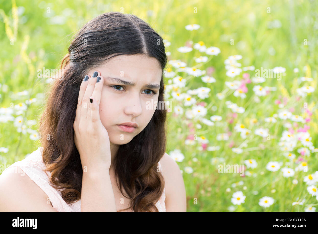 Teen girl thinks about the problems outside Stock Photo