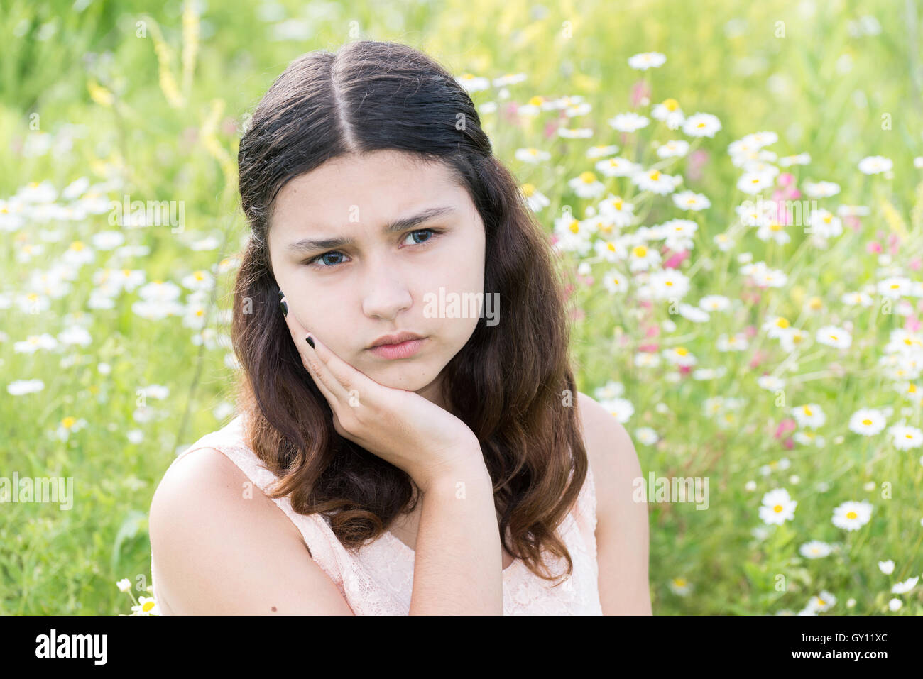 girl thinks about the problems outside Stock Photo