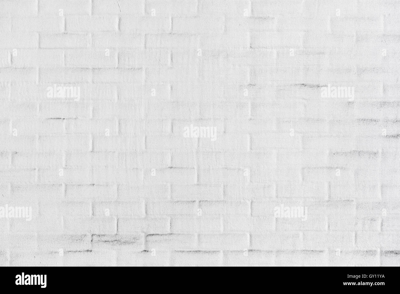 White brick wall with plastering layer, background photo texture Stock Photo