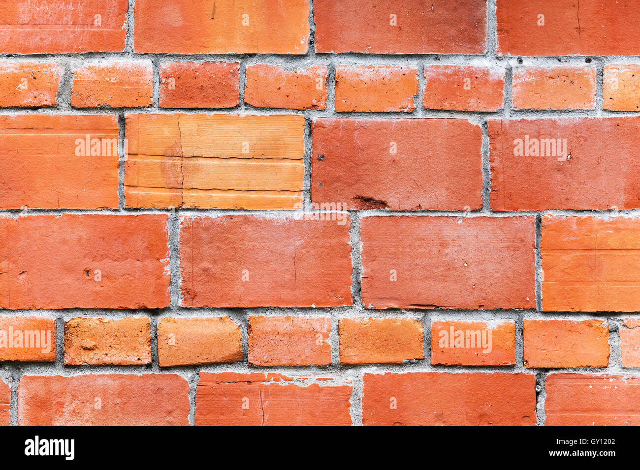 Bright red brick wall mansonry pattern, background photo texture Stock Photo