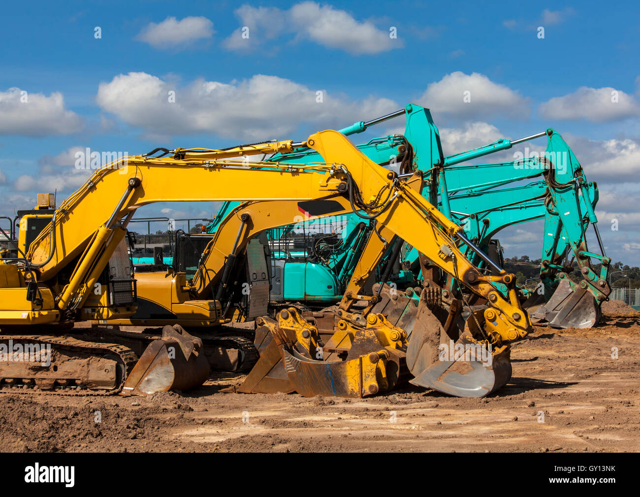 Earth moving equipment lined up in depot ready for work Stock Photo Alamy
