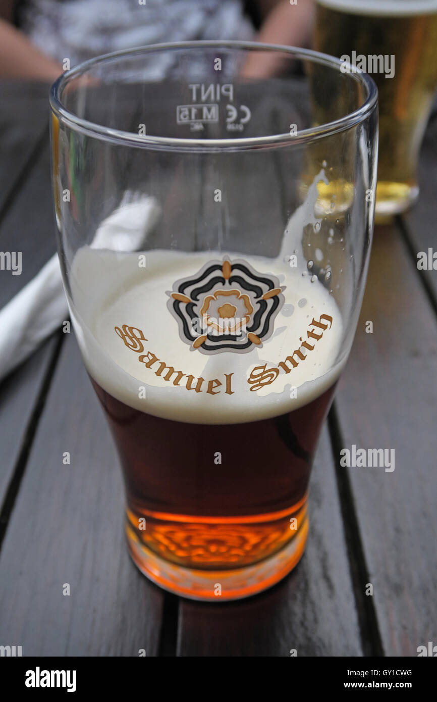 Glass Half Full, Samuel Smith pint glass, Vine Inn, Dunham, Altrincham, Cheshire, England, UK Stock Photo