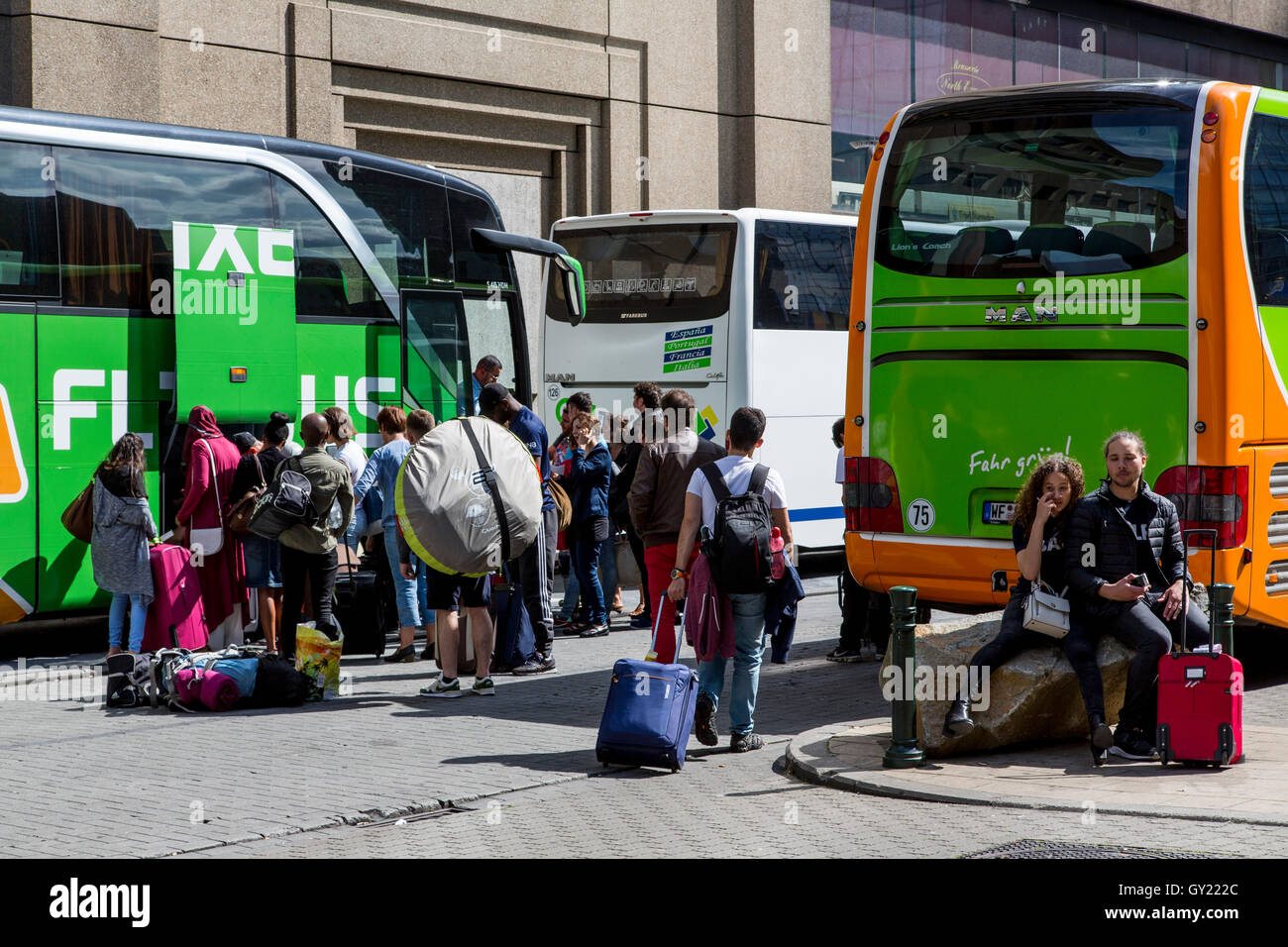 Bus station at Brussels North Station, Belgium, Flixbus, passengers get in, loading luggage into