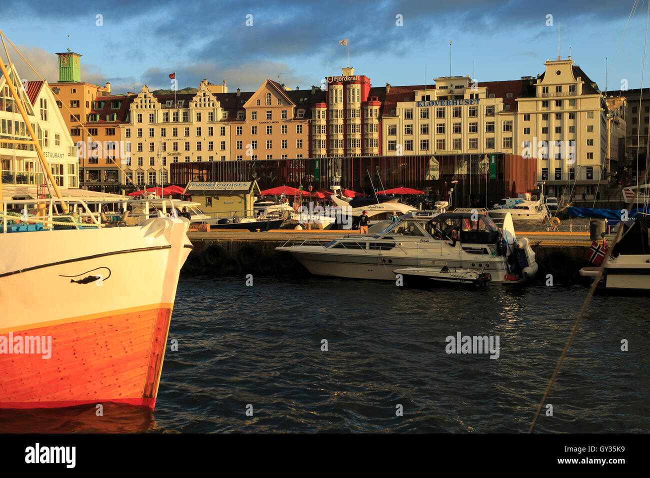 Sailing yachts and historic buildings evening light, Vagen harbour, Bergen, Norway Stock Photo