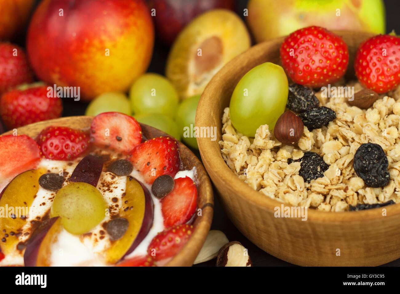 Healthy breakfast with cereals and colorful fruits. Yogurt with fruit