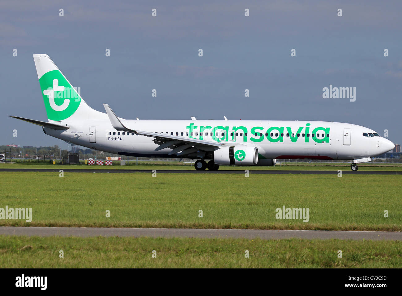 Transavia Boeing 737-800 touches down on runway 18R at Amsterdam Schipol airport. Stock Photo