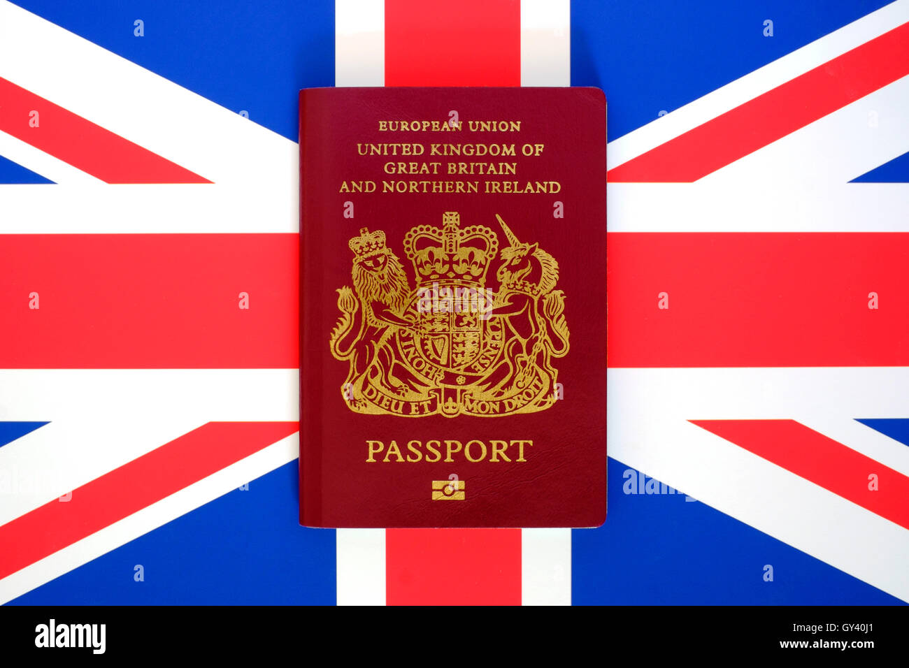 united kingdom european union burgundy passport on a uk flag background Stock Photo