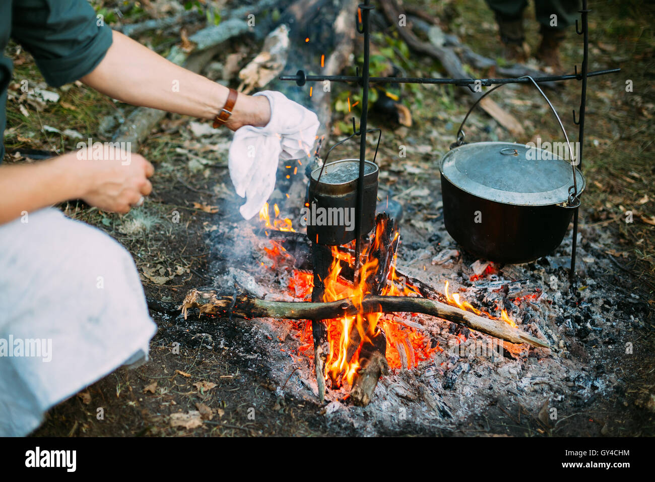 Campfire with a cooking pot stock photo containing campfire and cooking