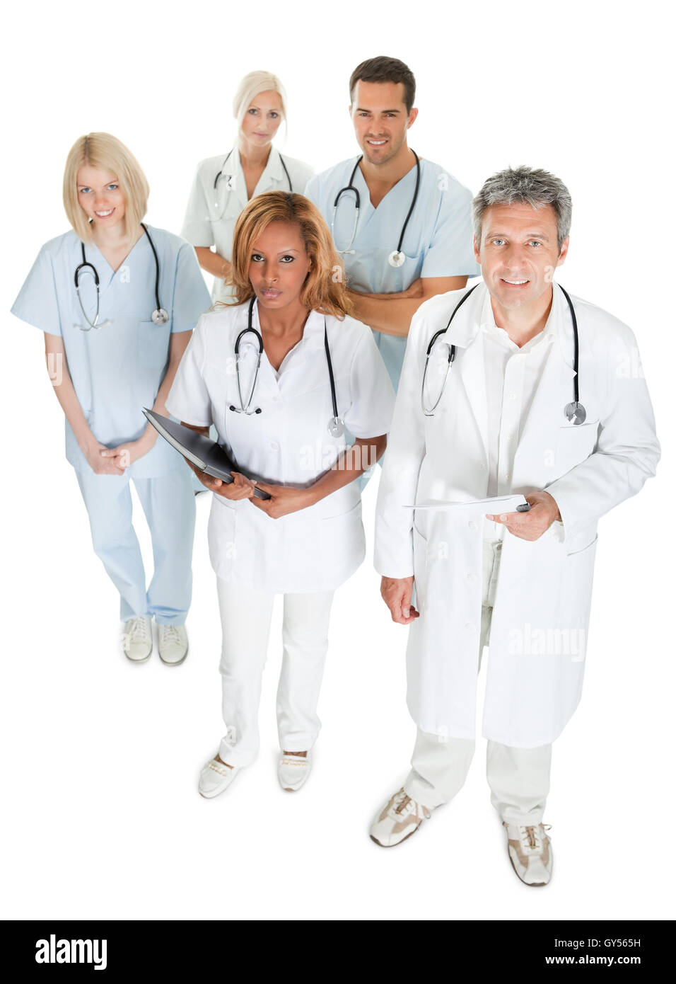 Diverse medical team looking up on white Stock Photo