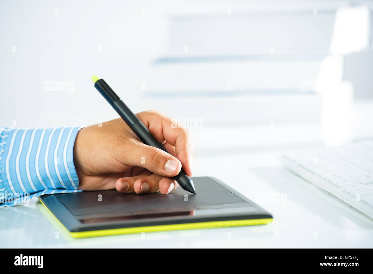 close-up of a man's hand with a pen stylus Stock Photo
