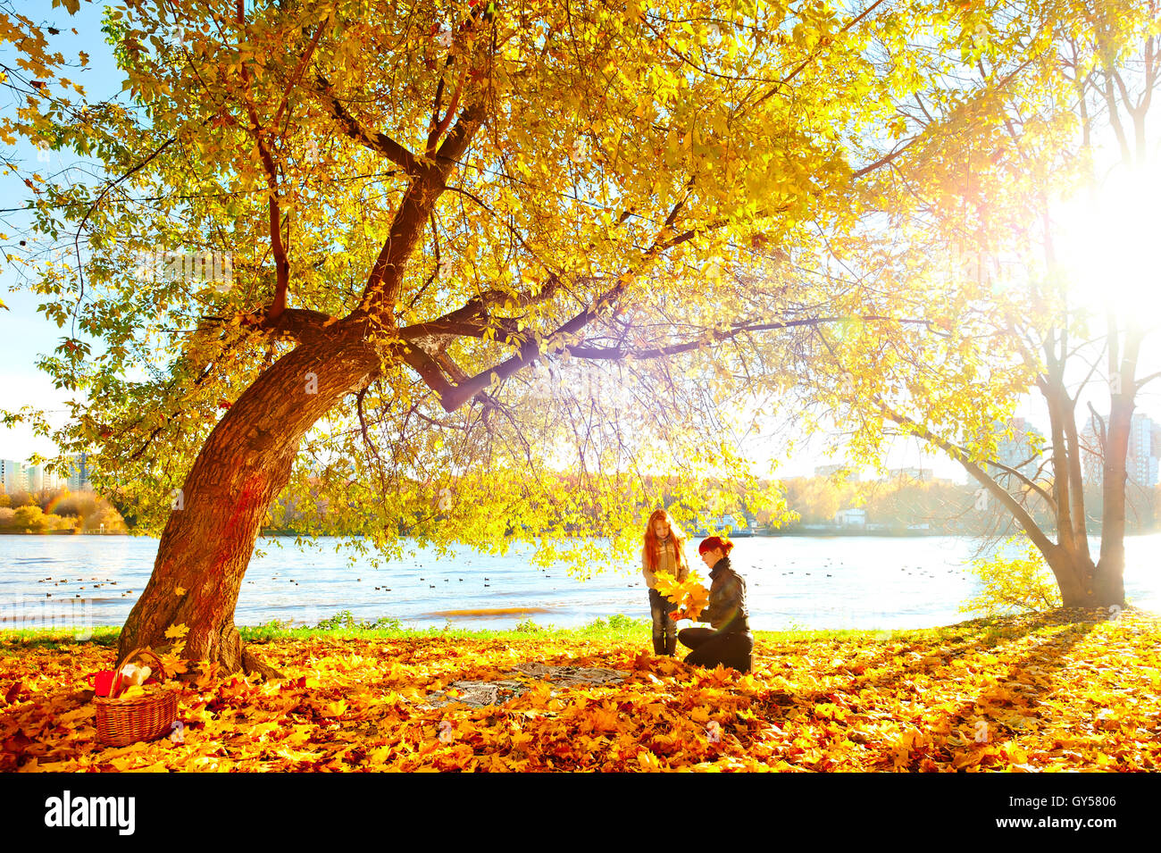 Mother and daughter in the autumn nature Stock Photo