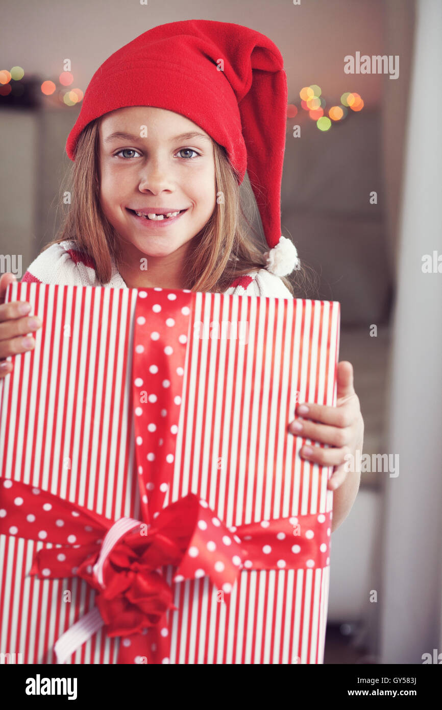 Child holding big gift Stock Photo