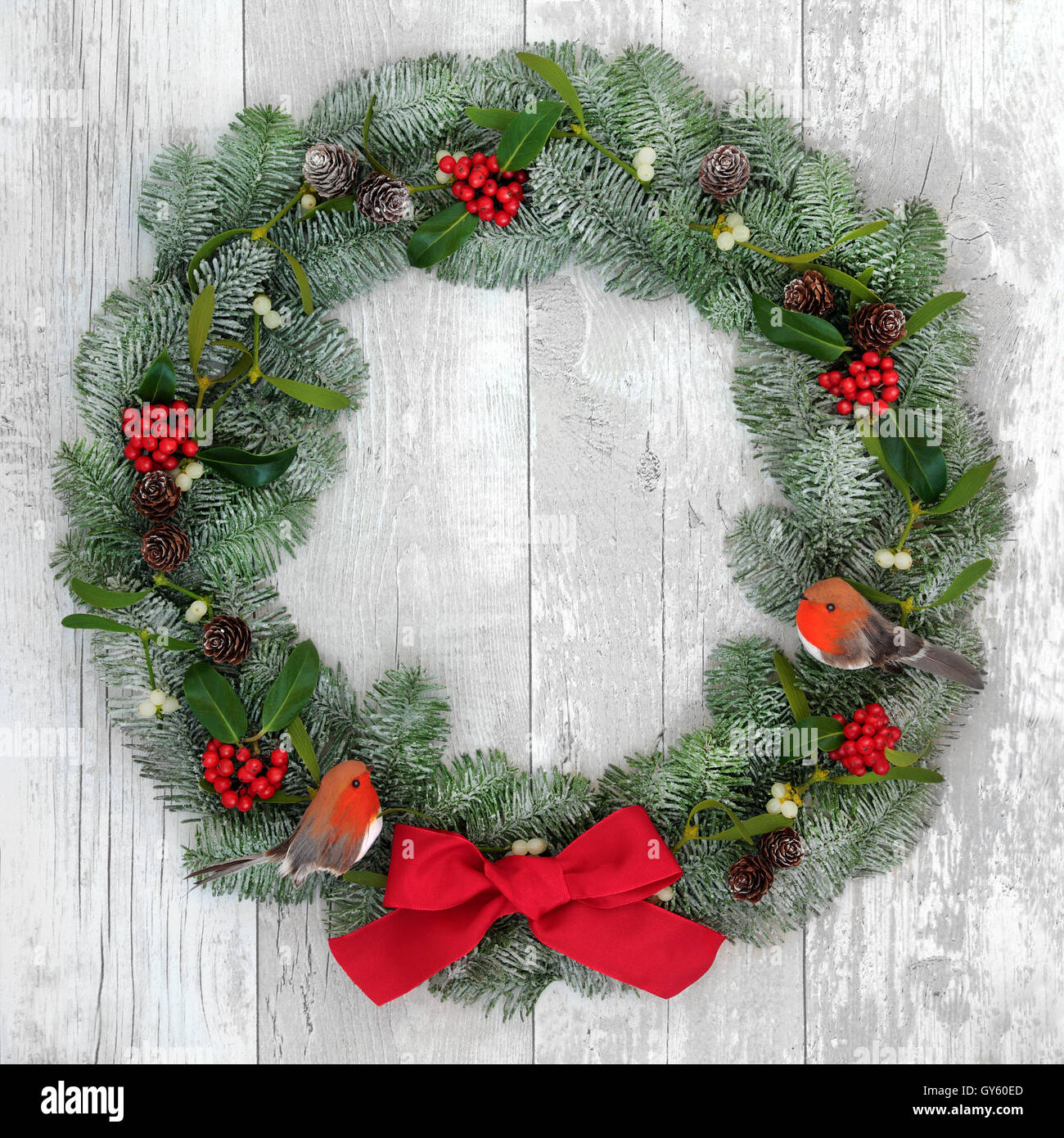 christmas wreath with robin decorations red bow holly mistletoe and snow covered blue - Mistletoe Christmas Decoration christmas wreath with robin decorations red bow holly mistletoe and snow covered blue - Mistletoe Christmas Decoration