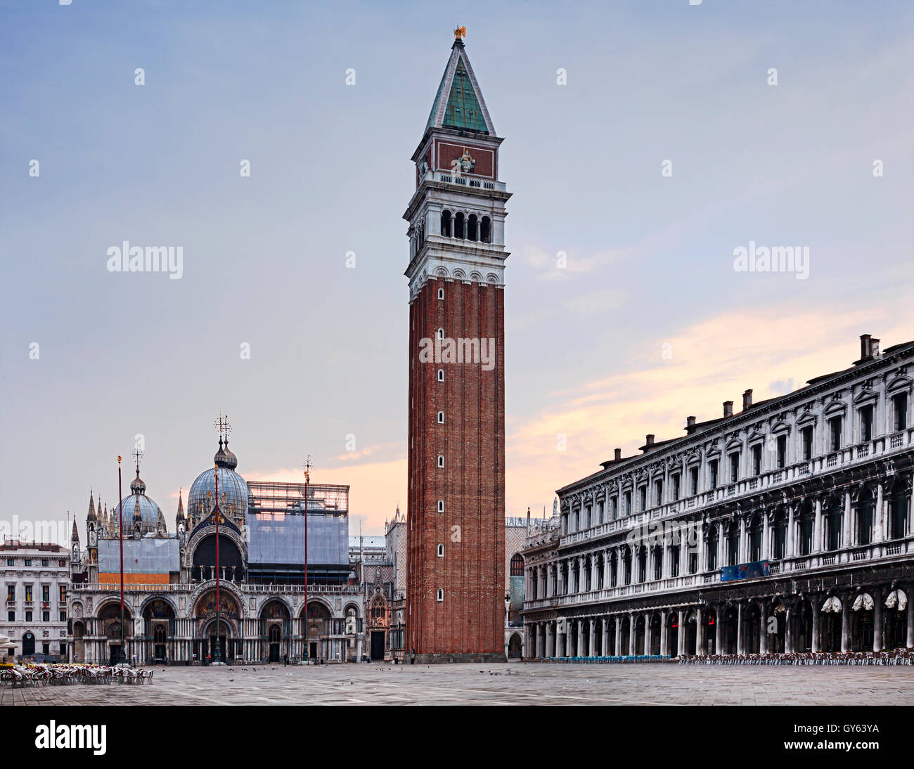 San Marco square, Campanile tower and Di San Marco cathedral in Venice at sunrise when nobody walks around city landmarks Stock Photo