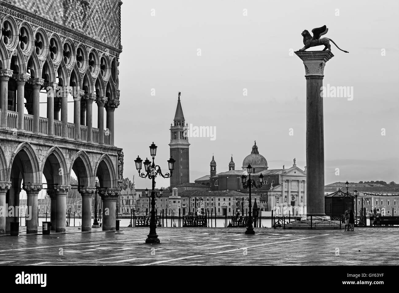 Blalck white photo of San Marco square in Venice, Italy, towards Doges palace and gondola pier on Grand Canal in front of San Gi Stock Photo