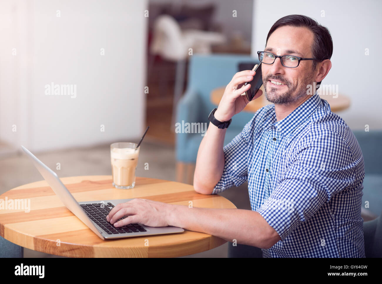 Nice hardworking man talking per phone Stock Photo