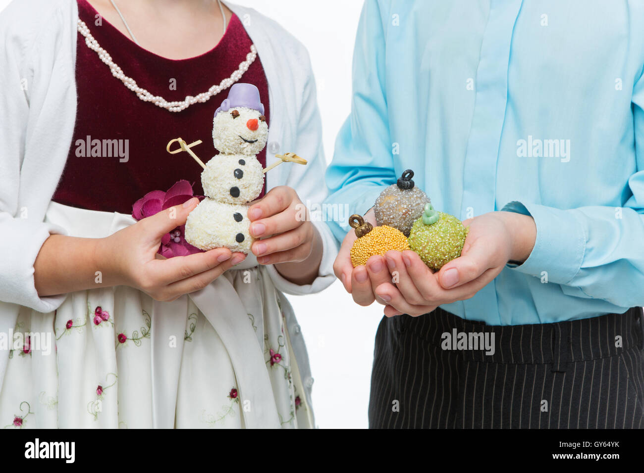 Children holding christmas dessert Stock Photo