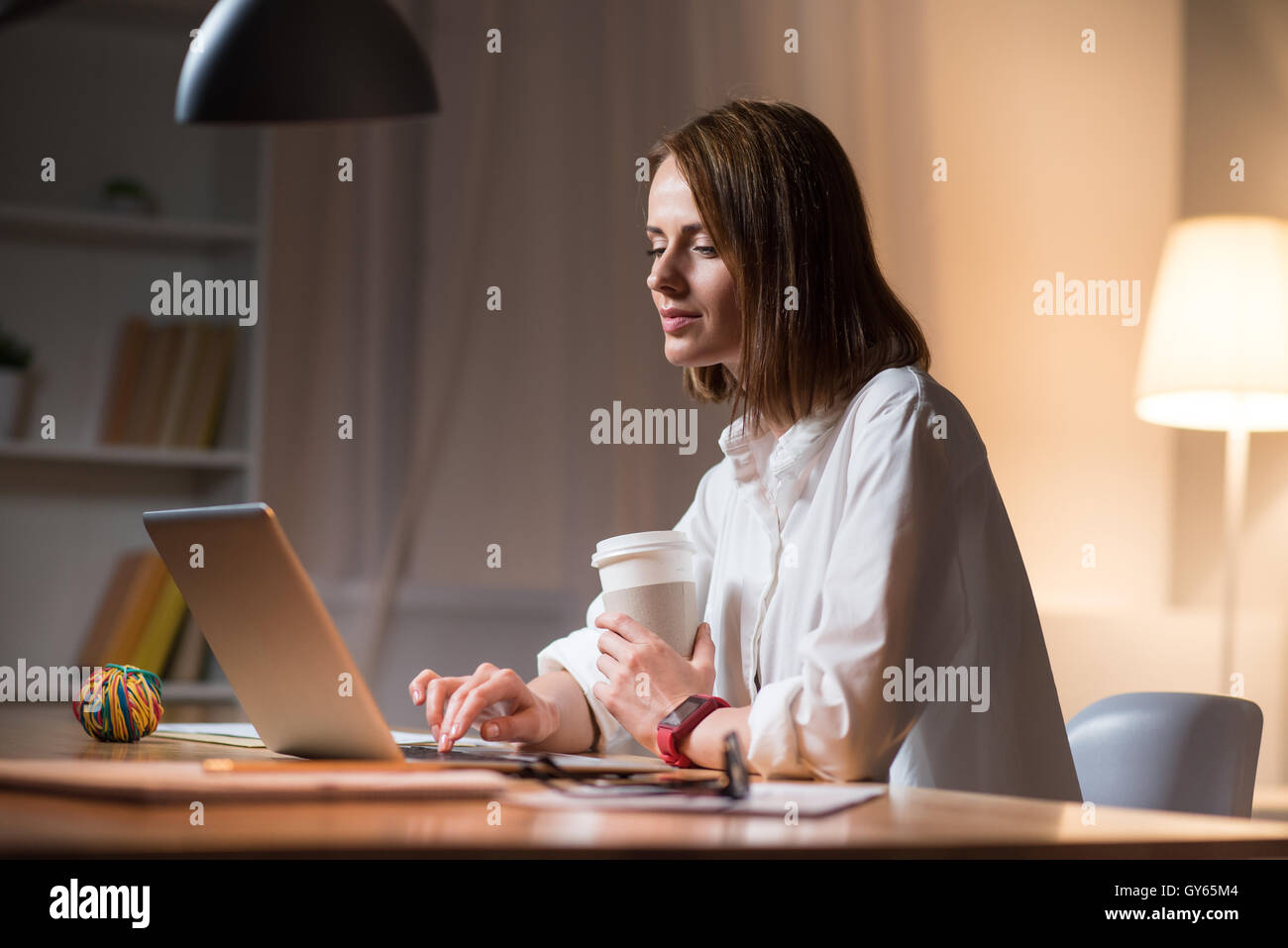 Beautiful woman finishing her work in an office Stock Photo Alamy
