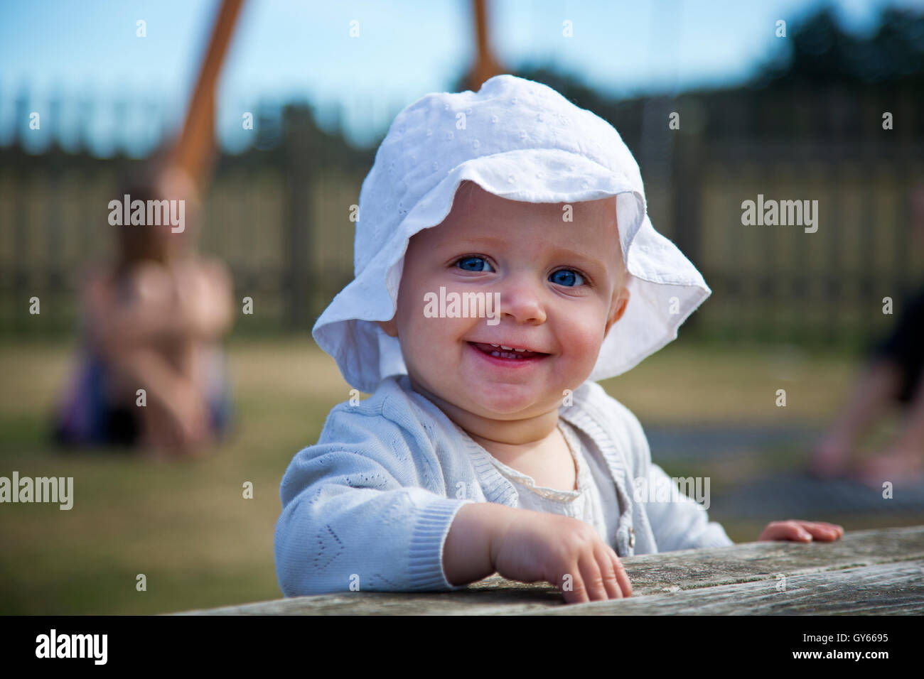 A one year old smiling baby girl Stock Photo