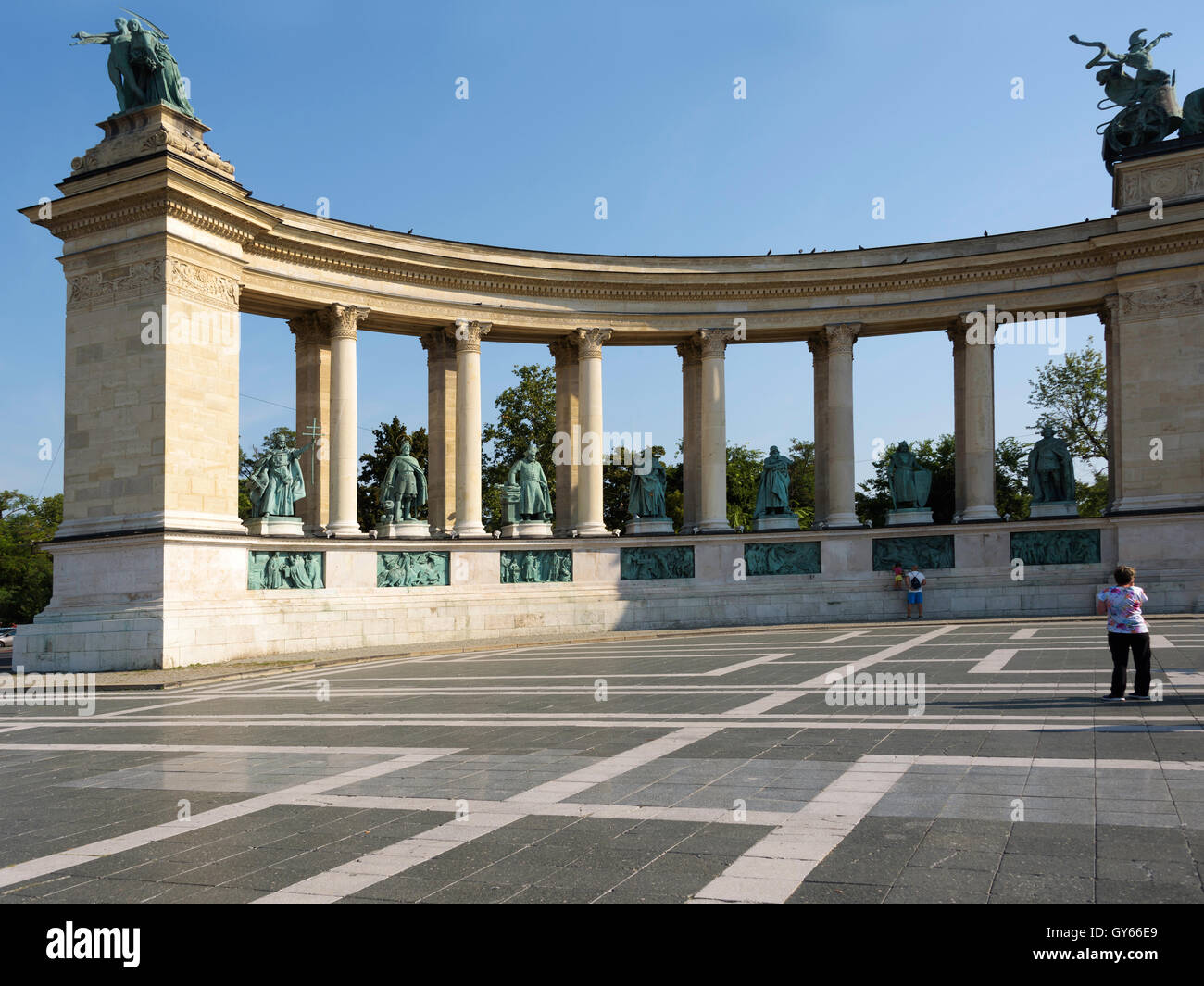 A tourist admiring one of the colonnades in Heroes Square. Stock Photo