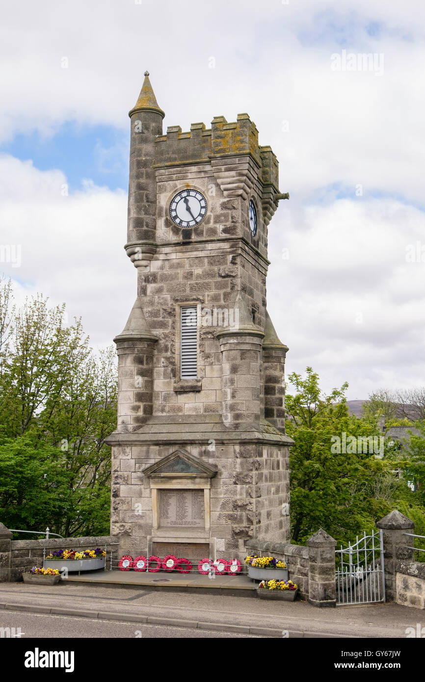 Clock tower memorial to both World Wars with wreaths of red remembrance Poppies. Brora Sutherland Highland Scotland UK Britain Stock Photo