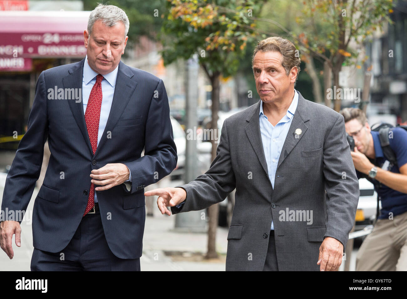 Chelsea, New York, USA. 18th Sept, 2016. New York State Governor Andre Cuomo and New York City Mayor (red tie) Bill de Blasio toured the site of the bomb explosion on West 23rd Street between Sixth and Seventh Avenues in Manhattan's Chelsea neighborhood, and then stopped at various local businesses to greet proprietors and residents. Credit:  PACIFIC PRESS/Alamy Live News Stock Photo