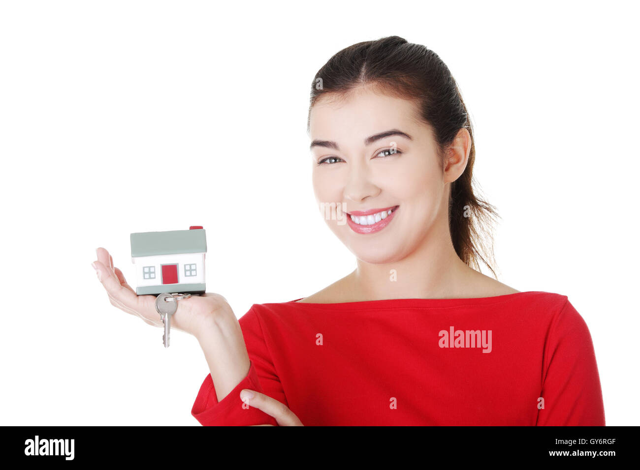 Happy casual woman holding home keys Stock Photo - Alamy
