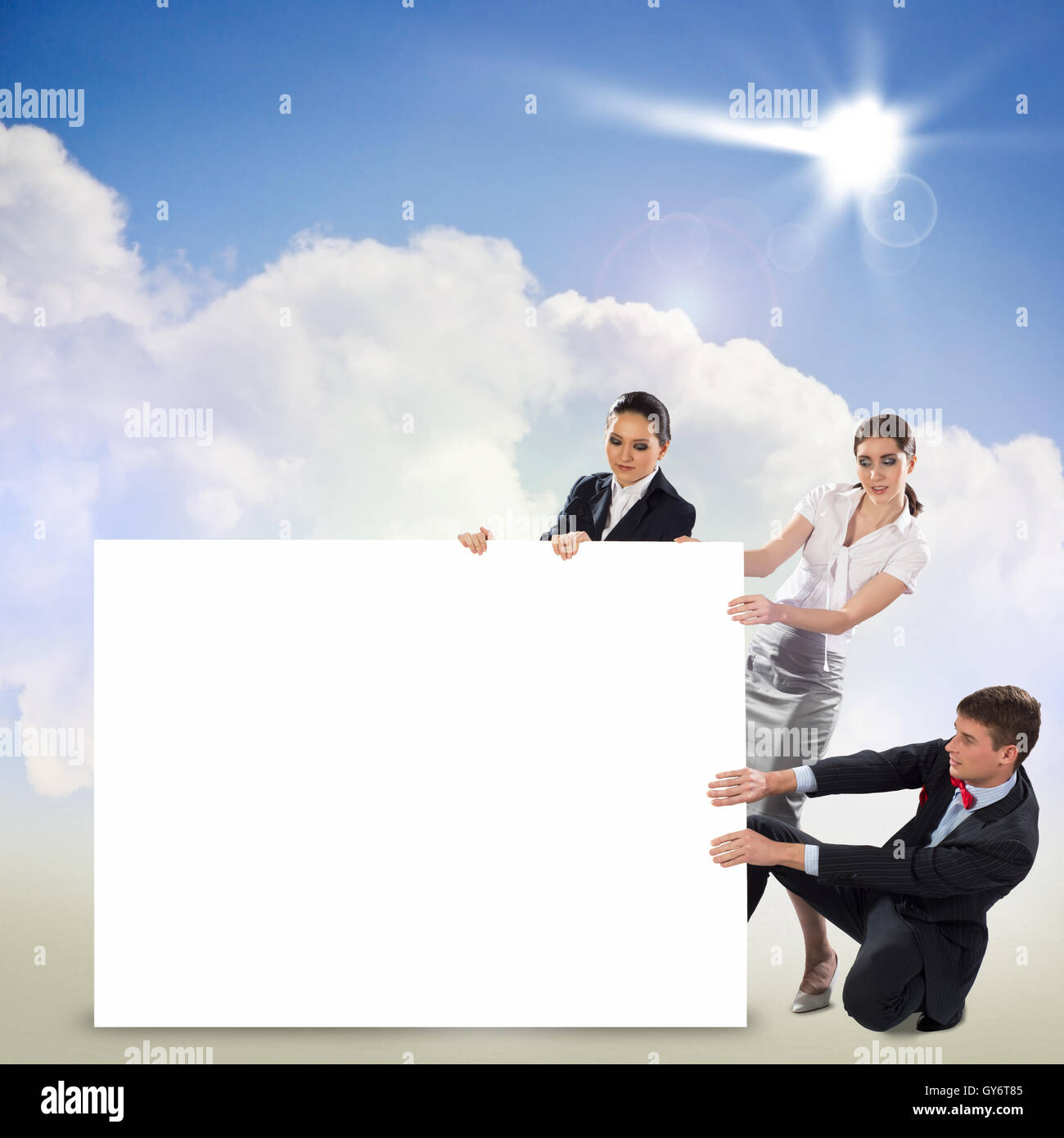 small group of people holding a blank banner Stock Photo - Alamy