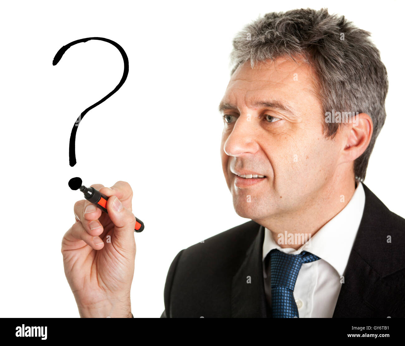 Businessman drawing a question mark Stock Photo