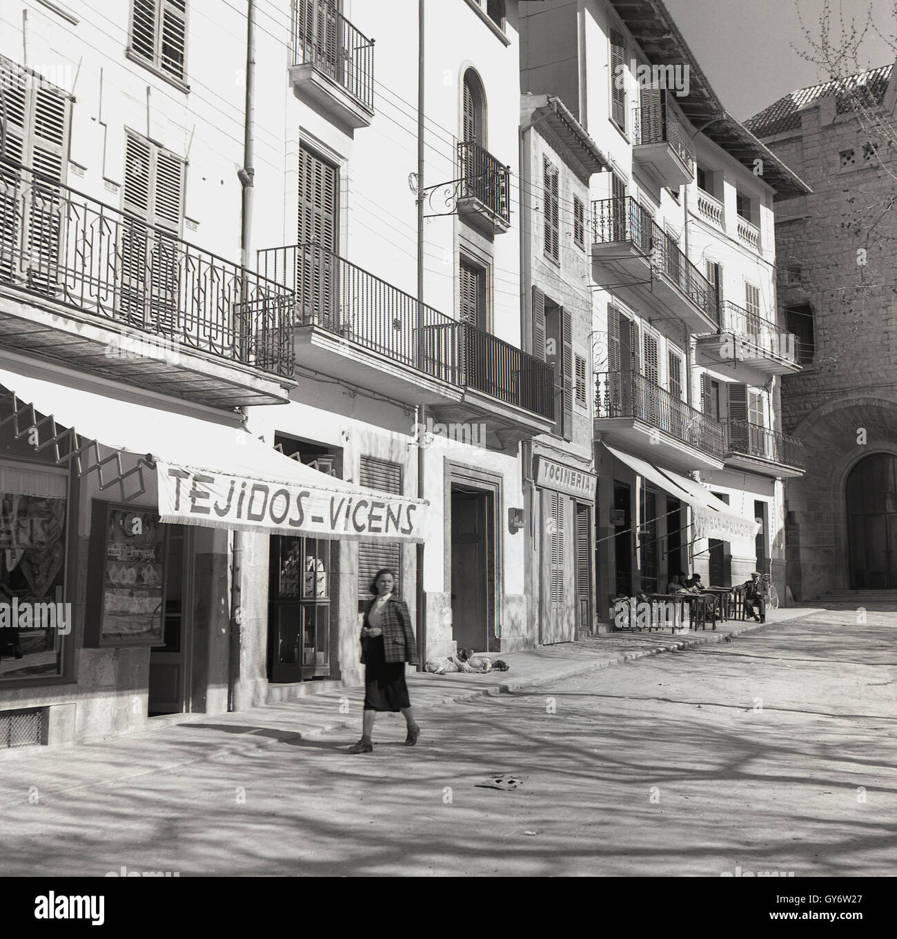 1950s, historical, lady walks down a quiet side street in Palma, Mallorca, Spain. Stock Photo