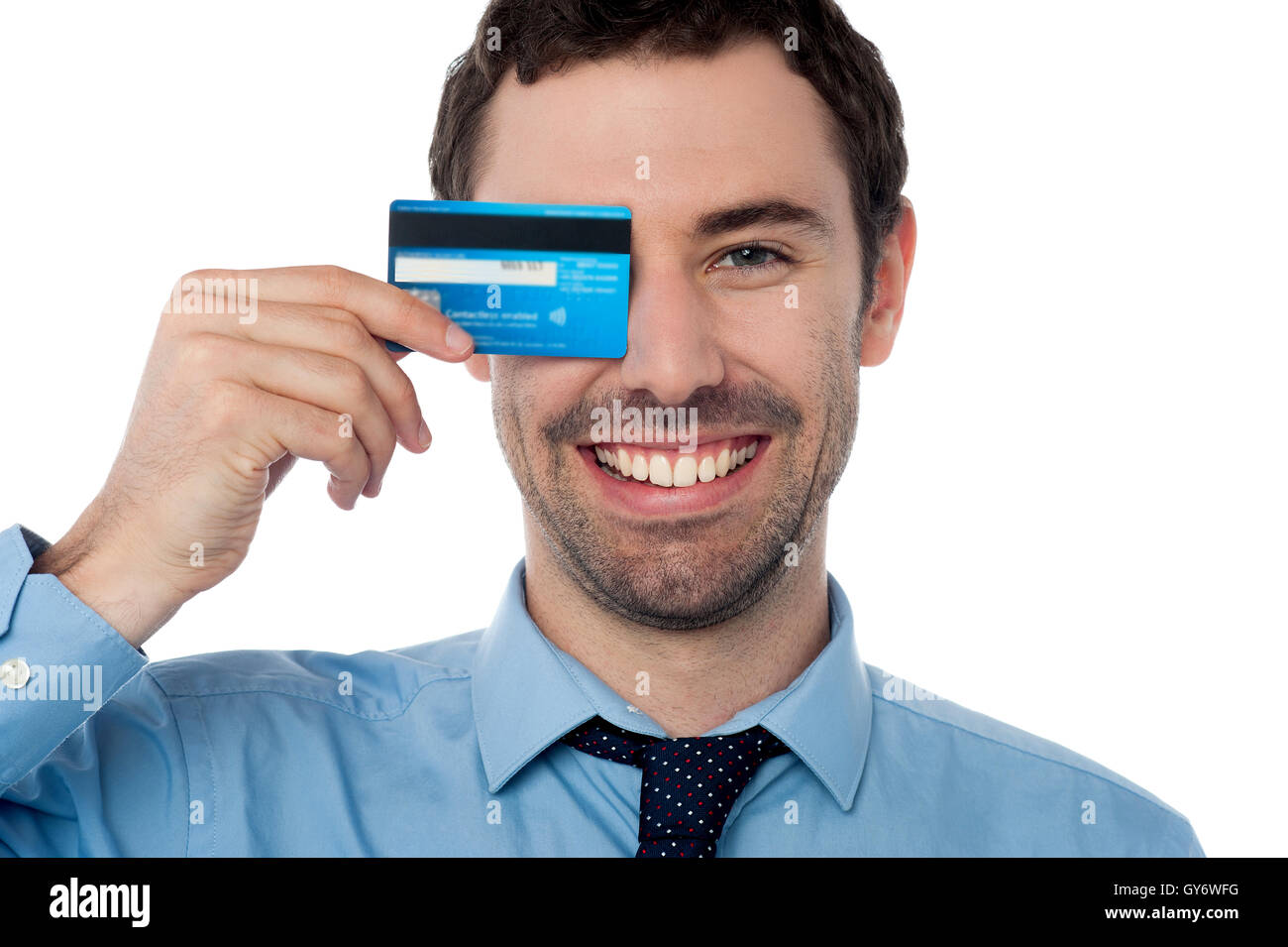 Businessman hiding his eye with credit card Stock Photo - Alamy