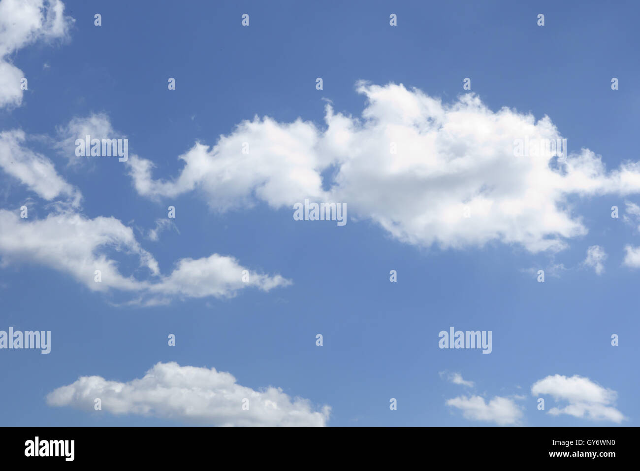 white clouds floating on a background of blue sky Stock Photo - Alamy