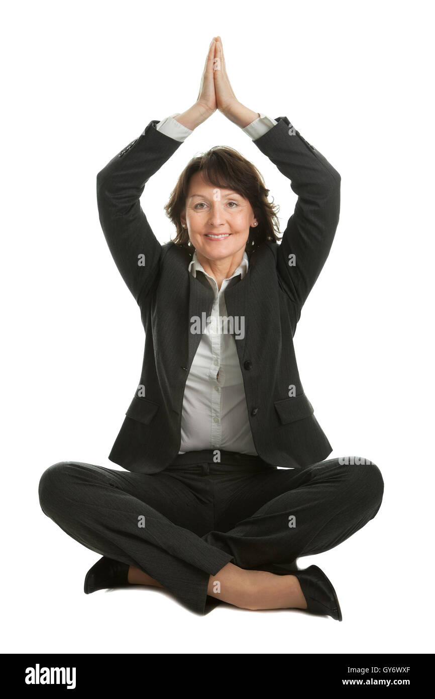 Slim Mature Woman Doing Exercises on Yoga Mat Isolated on White