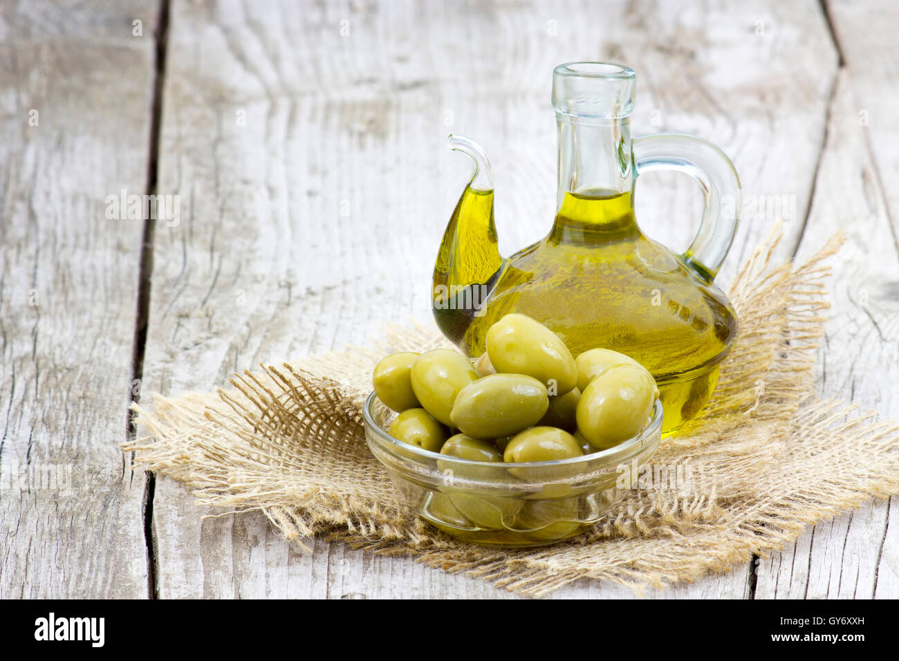 Olive oil and green olives Stock Photo - Alamy