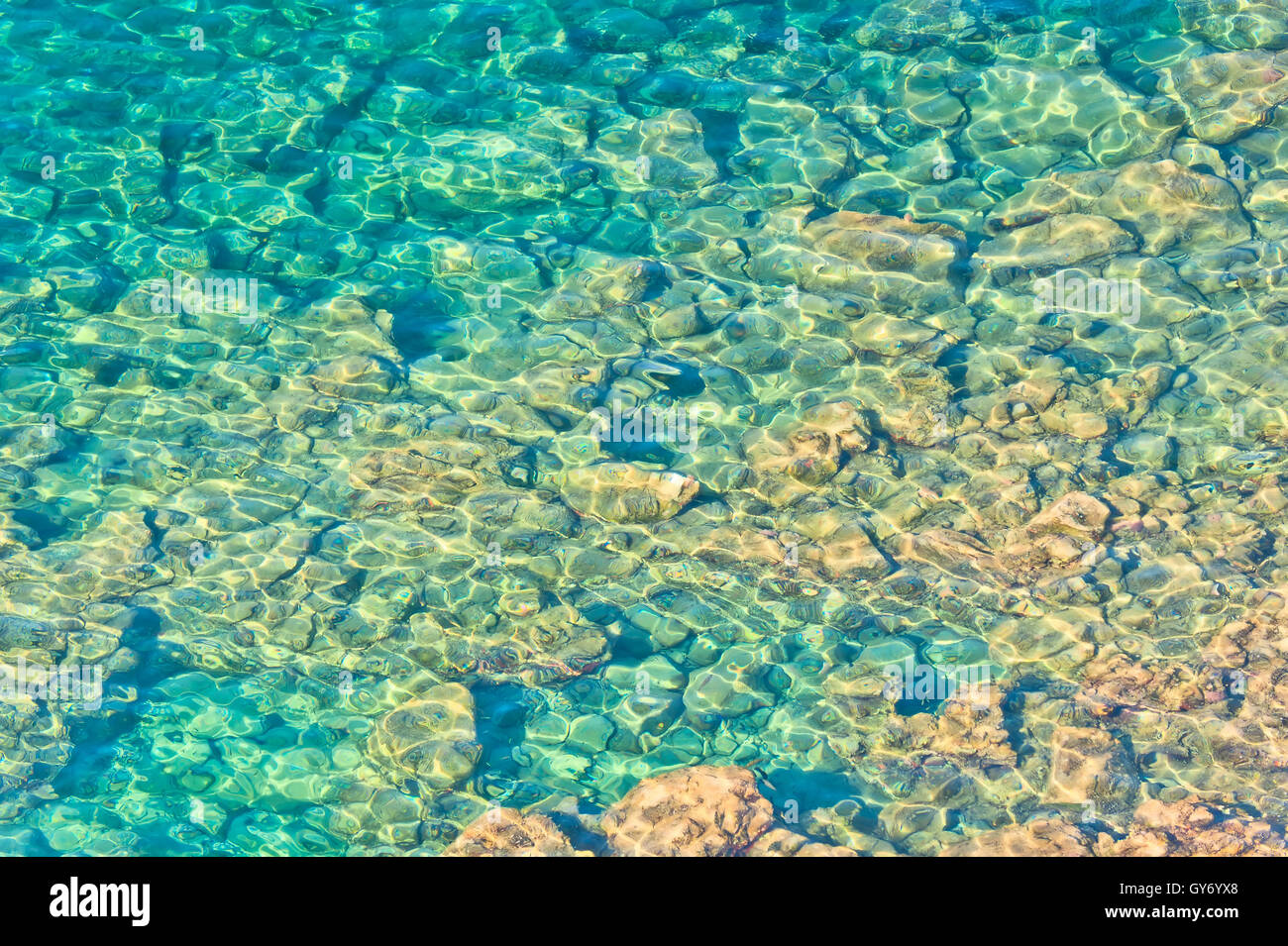 crystal clear waters and rocky bottom Stock Photo