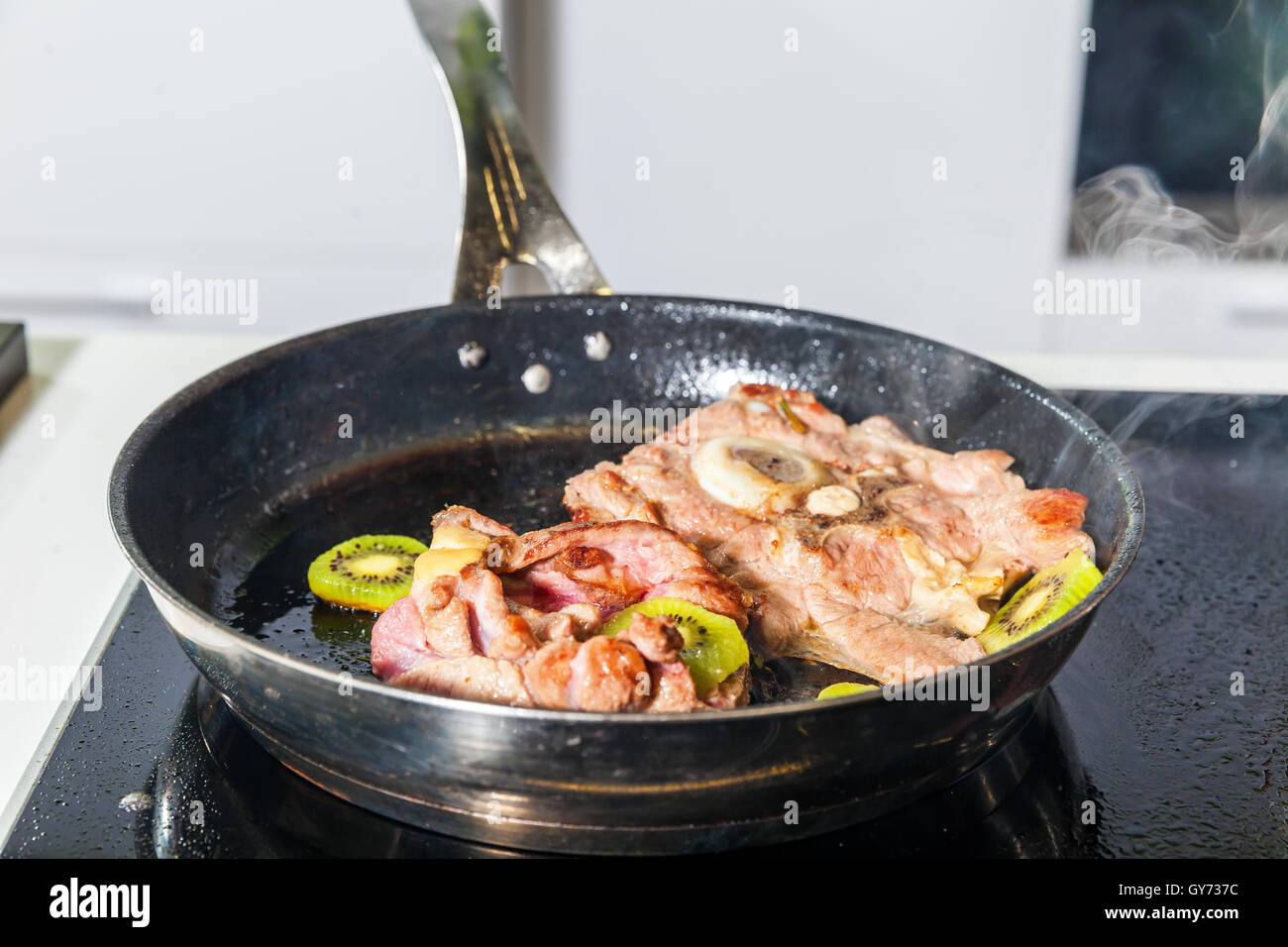 Meat with kiwi fruit Stock Photo Alamy