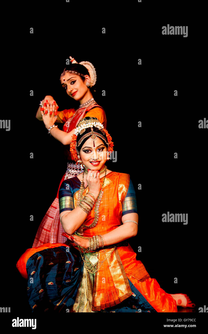 Some professional classical Indian dancers pose for a photoshoot Stock