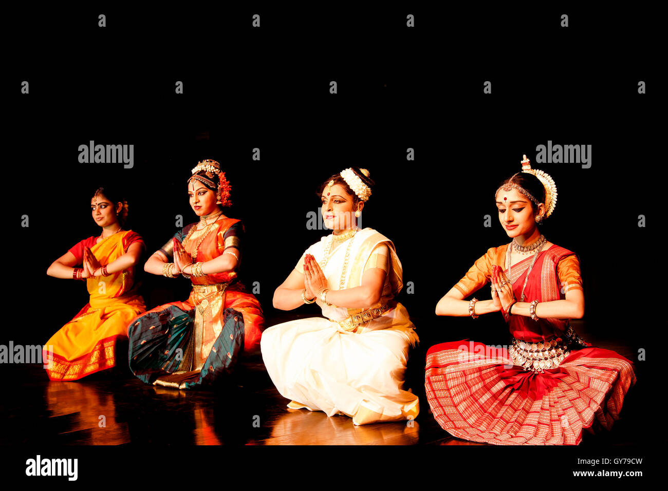 Some professional classical Indian dancers pose for a photoshoot Stock