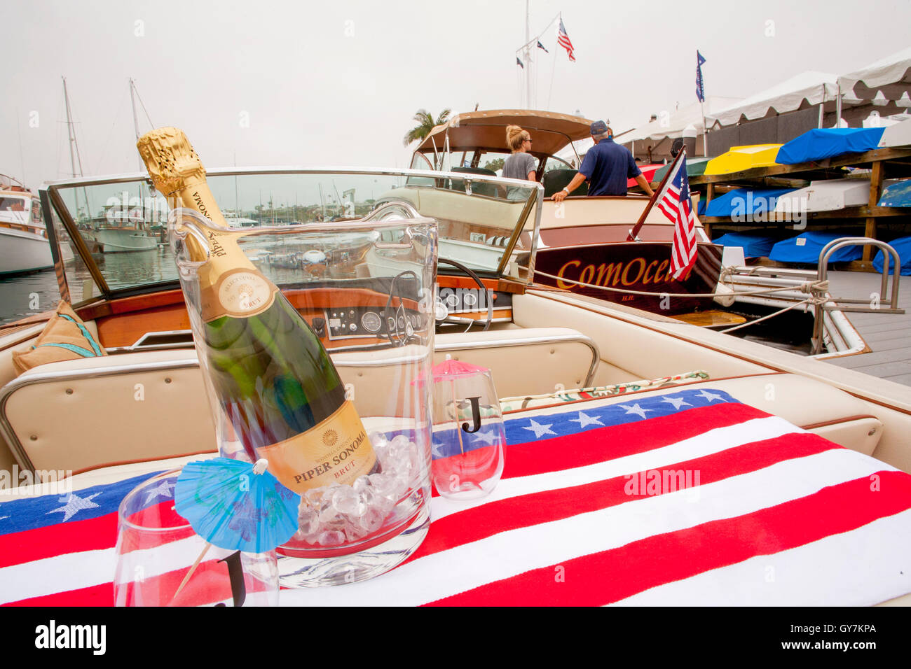 A bottle of champagne decorates a motor boat at an exhibition of