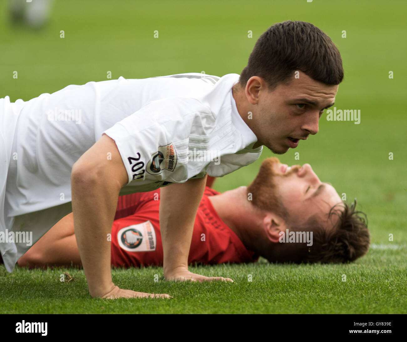 Ryan Jennings of AFC Fylde and Tom Allan of Alfreton Town on the ground after a collision Stock Photo