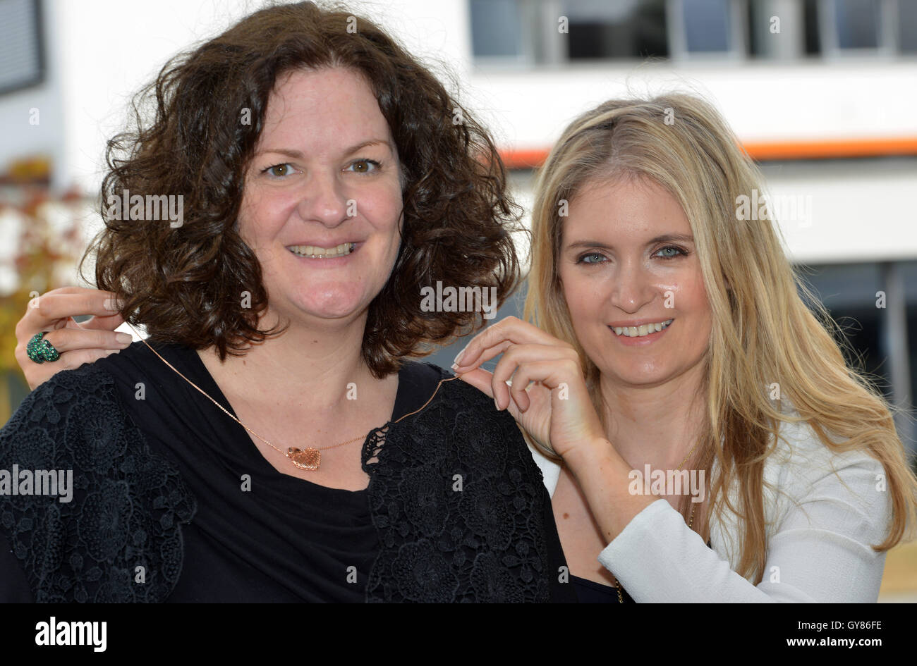 Birkenfeld, Germany. 17th Sep, 2016. Former model Felicity Gain (R) from London places the gold necklace on her life-saver, Siobhan Kirsten Mansfield, which she brought as a gift in Birkenfeld, Germany, 17 September 2016. In 2002, 44-year-old Mansfield from Trassem, Germany donated bone marrow for Felicity Gain, now 38, which saved her life. Phoot: HARALD TITTEL/dpa/Alamy Live News Stock Photo