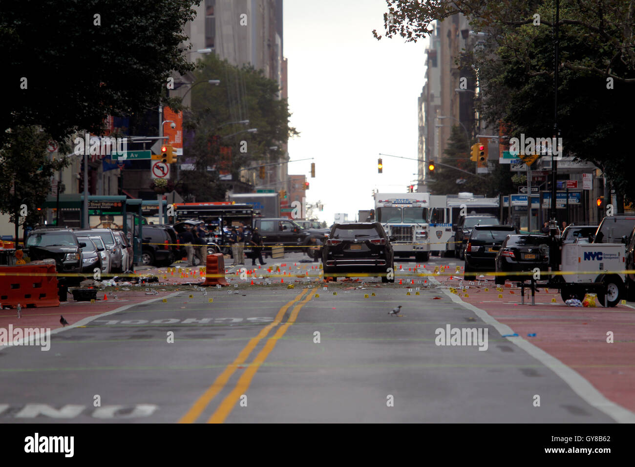 New York, USA. 18th Sep, 2016. Police, and law enforcement personnel from various agencies examine the area for clues the morning after last night's explosion on New York's West 23rd Street between 6th and 7th Avenues in the Chelsea section of Manhattan. the view is looking east on 23rd street from 7th Avenue towards 6th Avenue. The area is marked for clues amidst the debris. 29 people were injured in the blast which has been described by officials as intentional. Credit:  Adam Stoltman/Alamy Live News Stock Photo