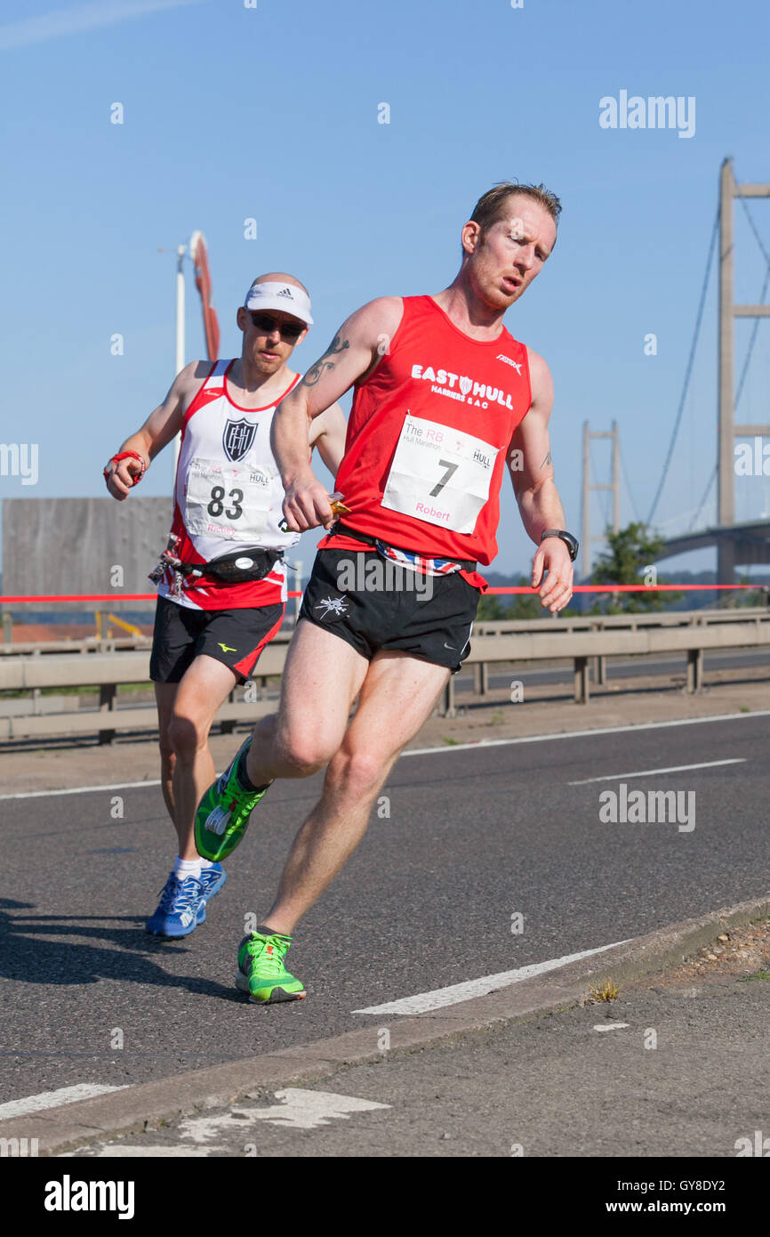 Barton-upon-Humber, North Lincolnshire, UK. 18th September 2016. Runner Robert Weekes (number 7) crosses the Humber Bridge on his way to third place in the RB Hull Marathon 2016 in a time of 02:45:02. Credit:  LEE BEEL/Alamy Live News Stock Photo