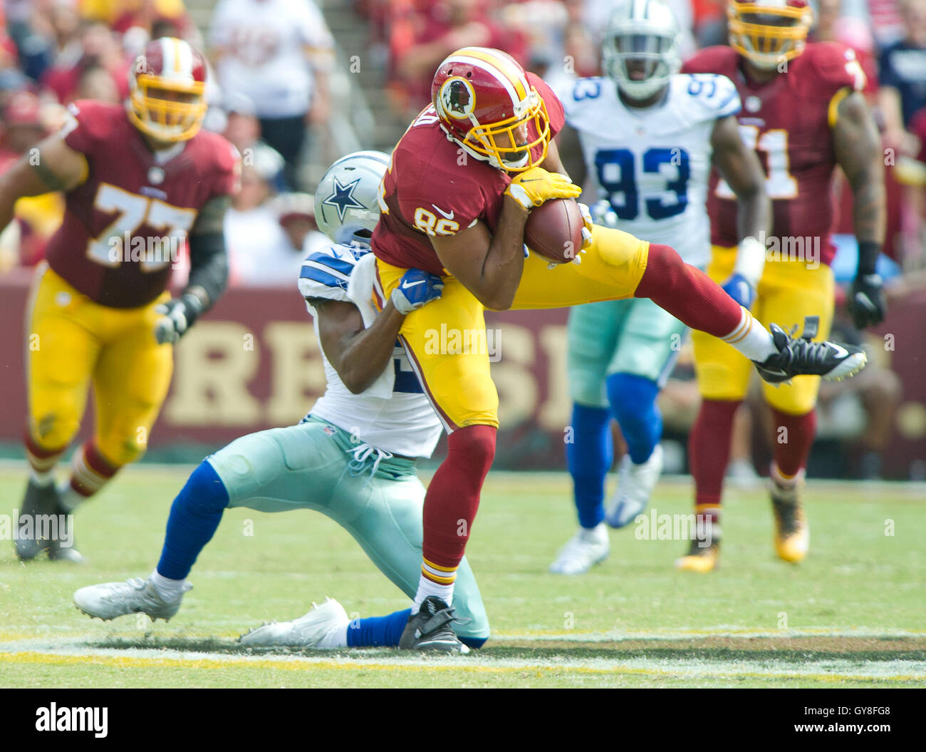 Dallas safety Byron Jones (31) celebrates his interception for a touchdown  during the fourth quarter against the Washington Redskins at FedEx Field on  October 29, 2017 in Landover, MD. Dallas won 33-19.