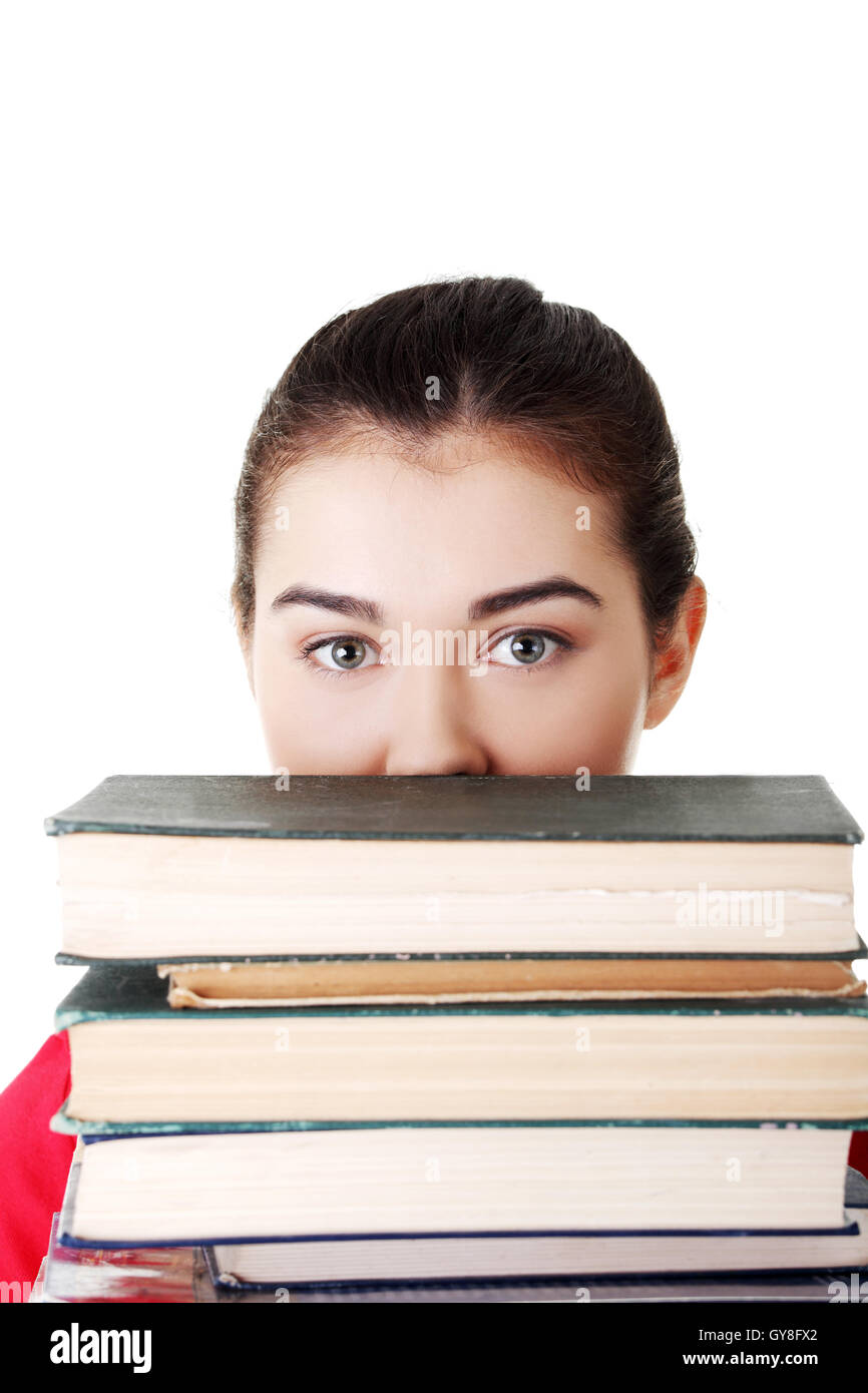 Attractive young woman with stack of books Stock Photo - Alamy
