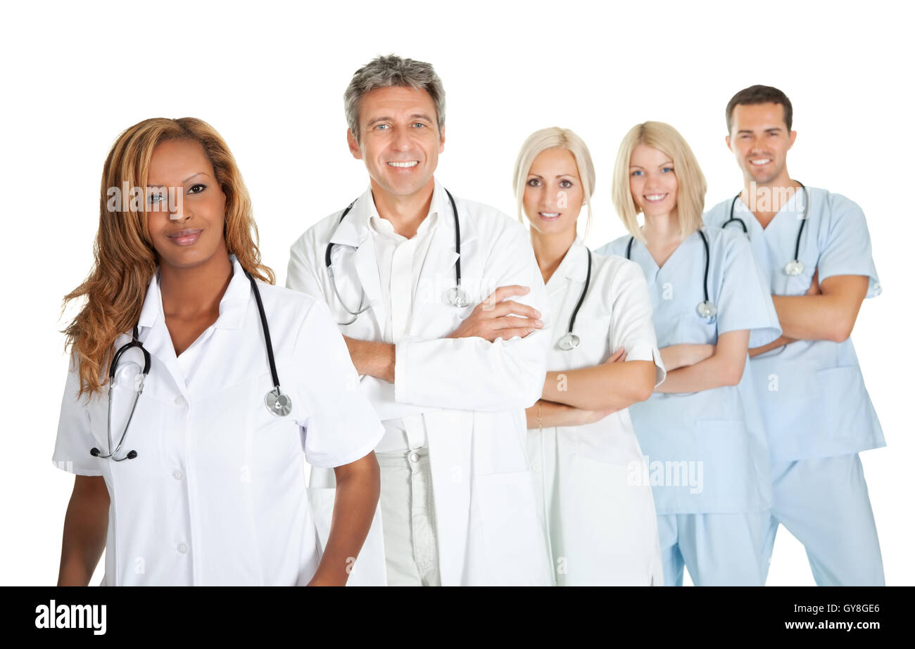 Friendly team of doctors smiling over white Stock Photo
