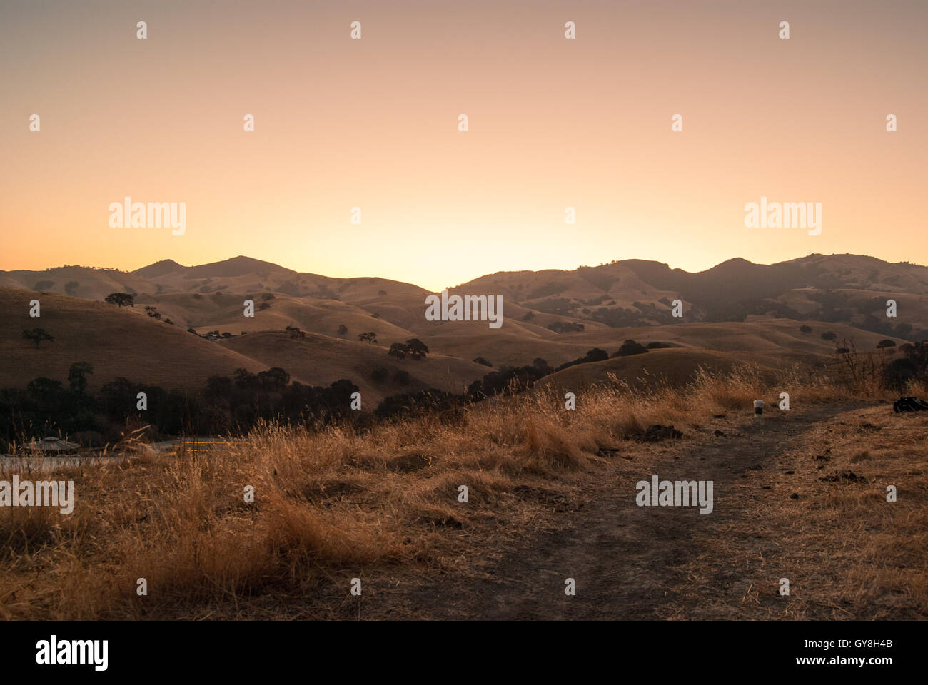 Sunrise Over Rolling Hill Horizon Stock Photo Alamy