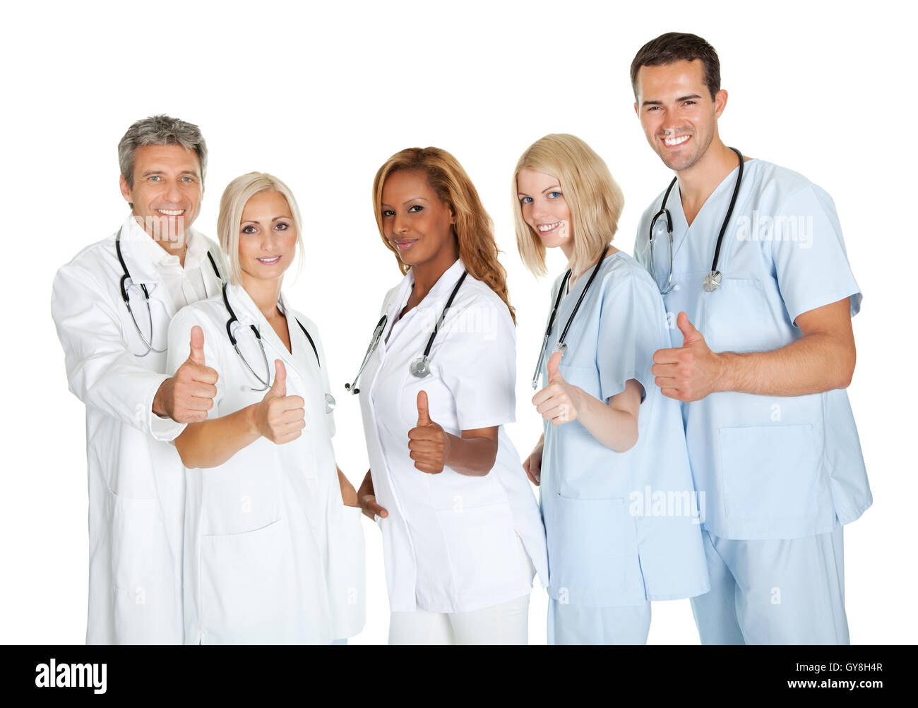Group of doctors giving thumbs up sign over white Stock Photo