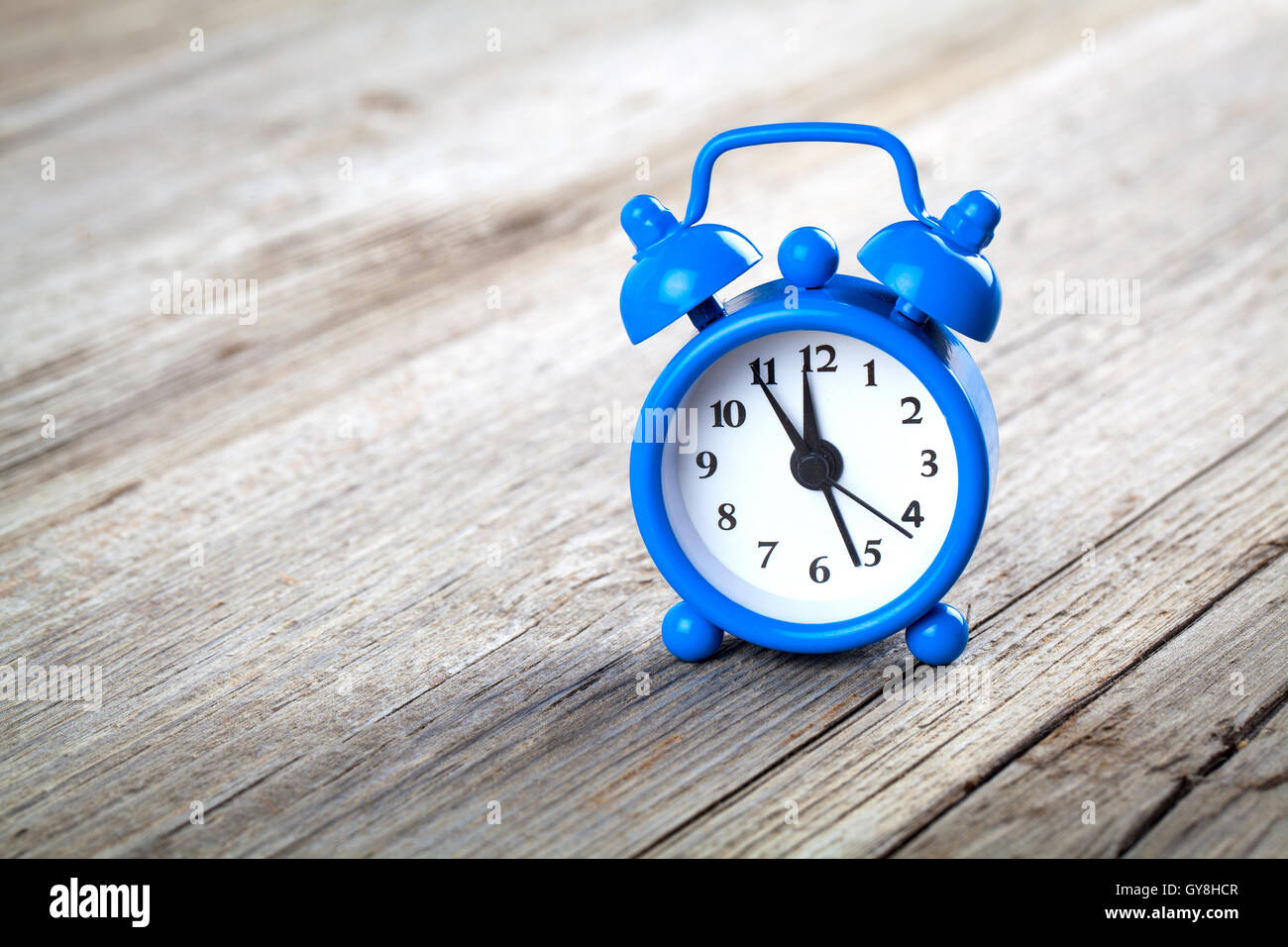 Vintage wooden background with retro alarm clock Stock Photo - Alamy